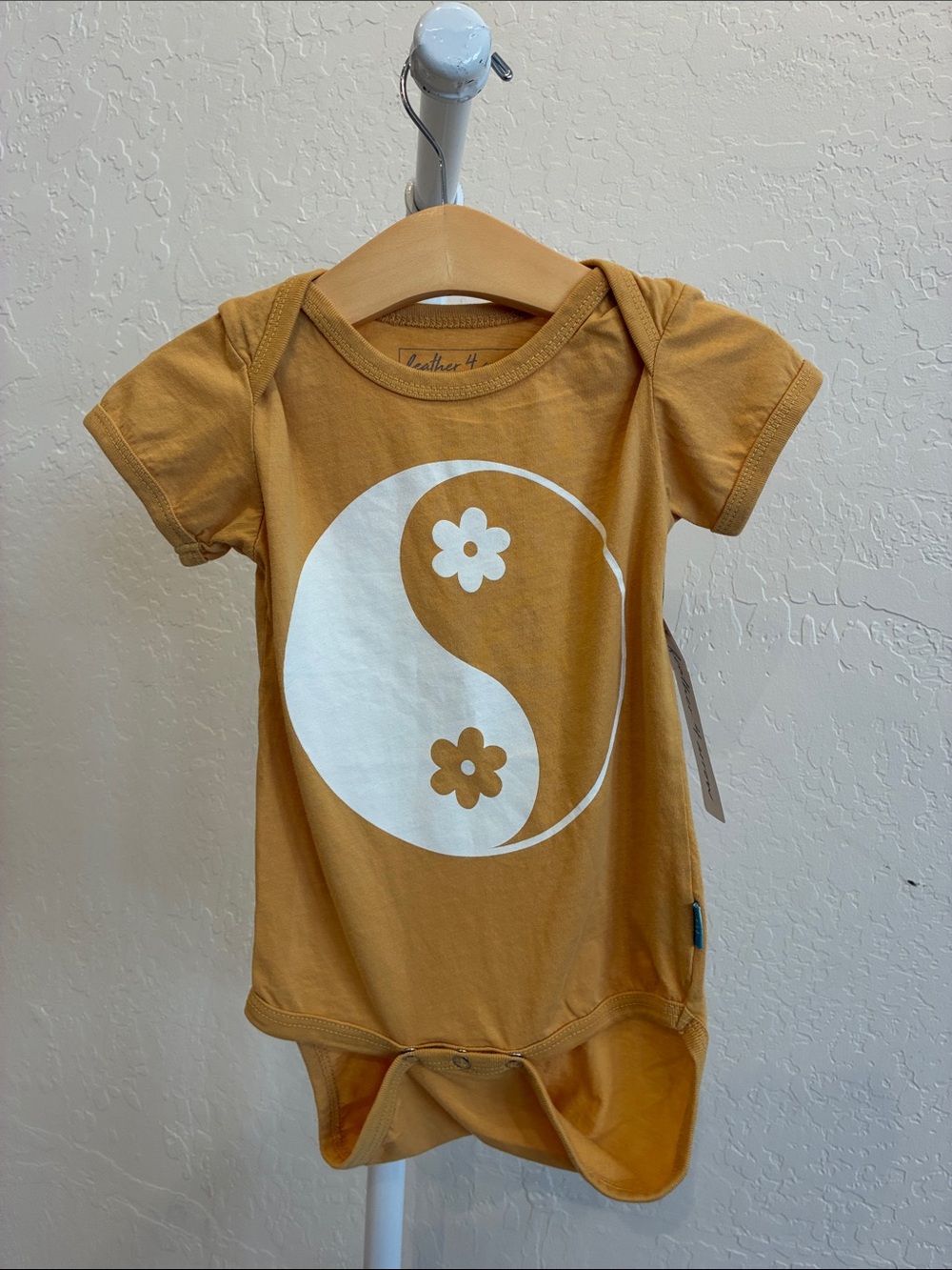 Mustard Yellow Yin Yang Flower Baby Bodysuit